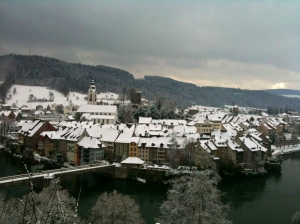 A view across the Rhine of the snow dusted rooftops of the Swiss Laufenburg. 